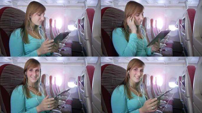 年轻女子在飞机上听音乐
