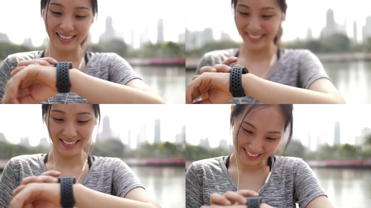 亚洲女性在智能手表上检查脉搏
