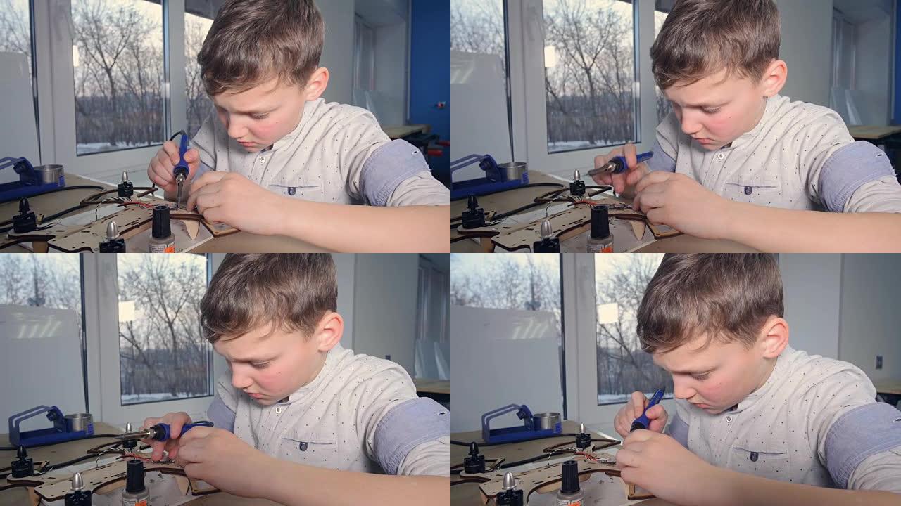 男生正在焊接无人机。