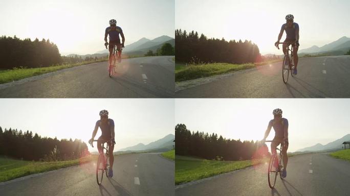 SUN FLARE: 职业公路自行车手在下午穿越乡村。