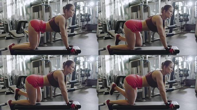 运动女性在健身房做抬腿运动