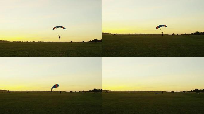 跳伞运动员在日落时降落