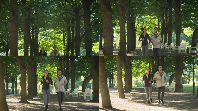 在公园晨跑期间，年轻的男人和女人朝着镜头前进。