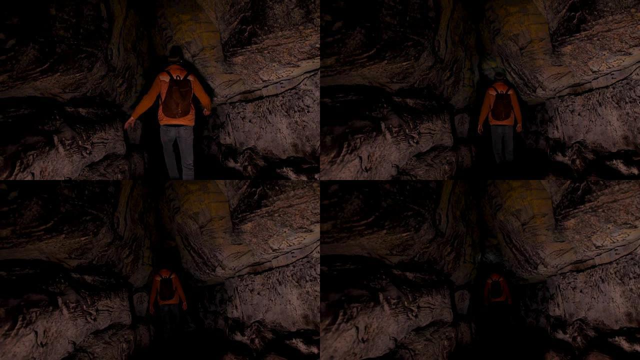 探索黑暗洞穴的男性徒步旅行者4k