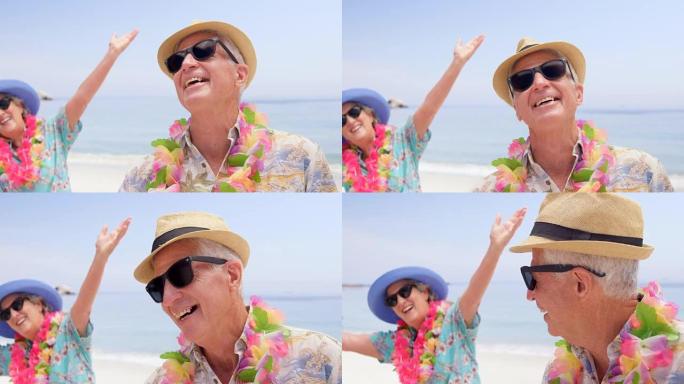 退休夫妇在沙滩上大笑