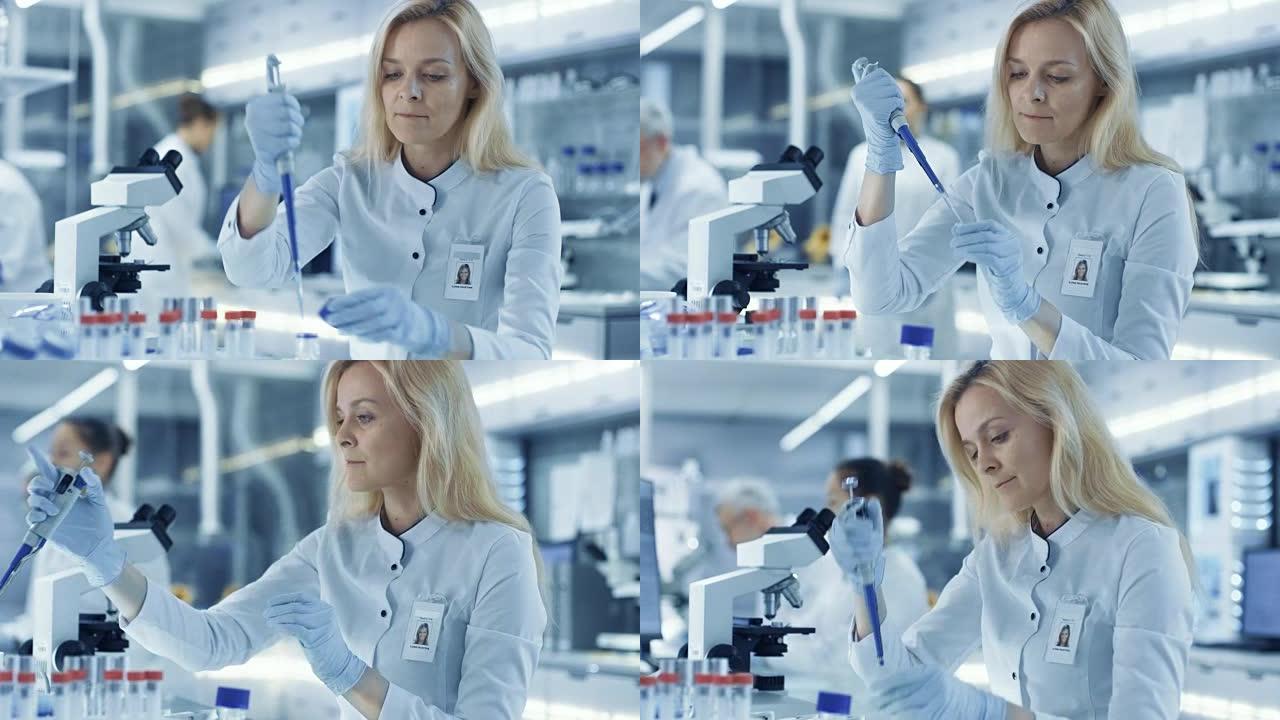 女性研究科学家使用微量移液器填充试管。科学家在大型实验室/研究中心工作。