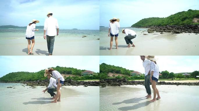 年轻的恋人夫妇一起在海滩上度假。