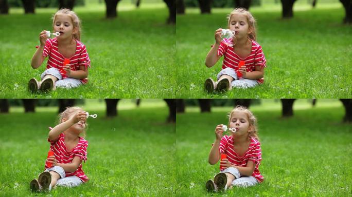 吹肥皂泡的小女孩