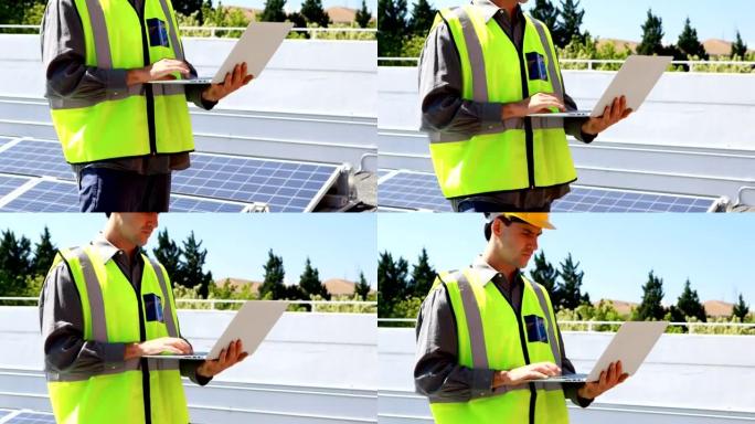 在4k太阳能站使用笔记本电脑的男性工人
