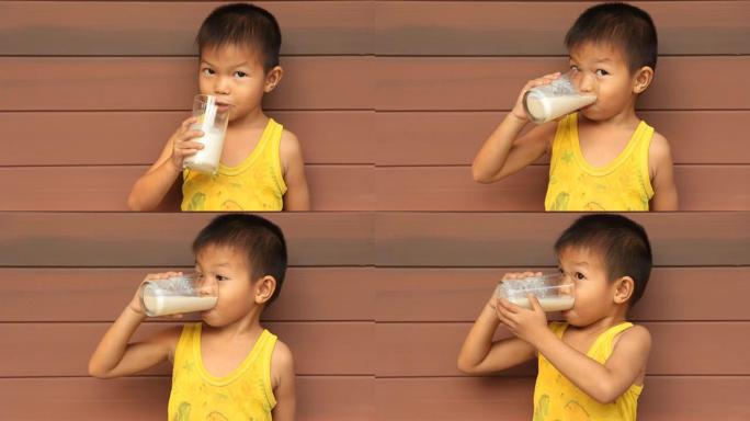 男孩正在喝牛奶。男孩正在喝牛奶