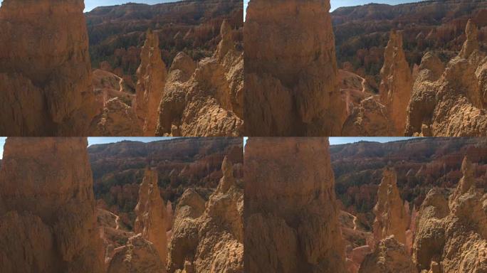 无法识别的游客徒步旅行经过布莱斯峡谷的砂岩hoodoos