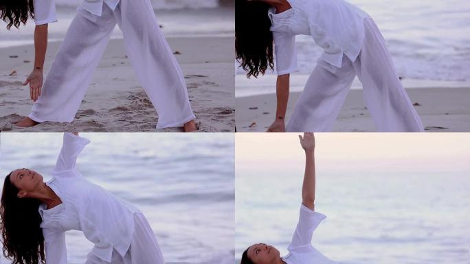 女人在海滩上练习瑜伽和伸展运动