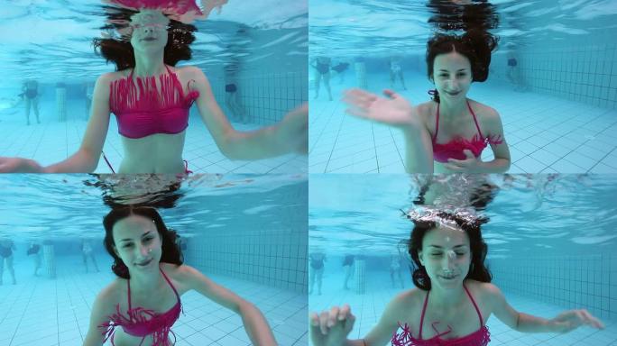 年轻女子在水下吹气泡