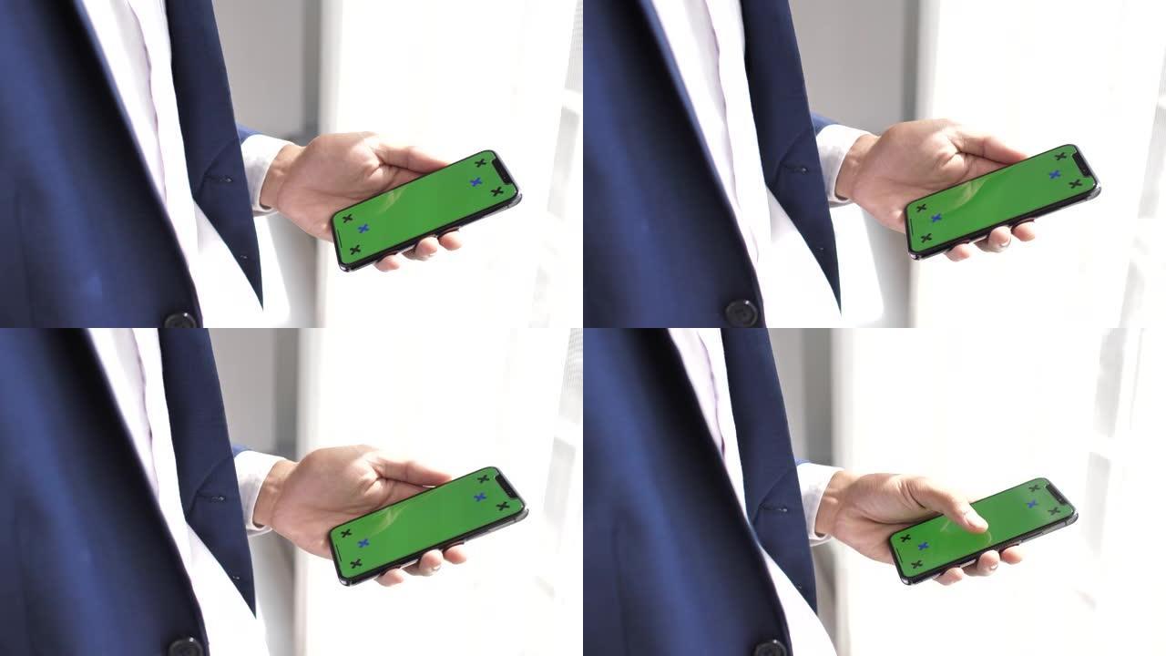 人手使用绿屏手机，iPhone X