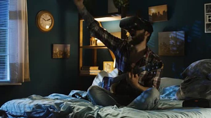 男子晚上在床上用VR眼镜弹吉他