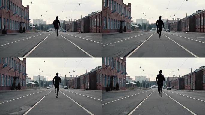 一个男人在老城区的街道上跑步。后视图。在通往成功和达到目标的路上。对比照片