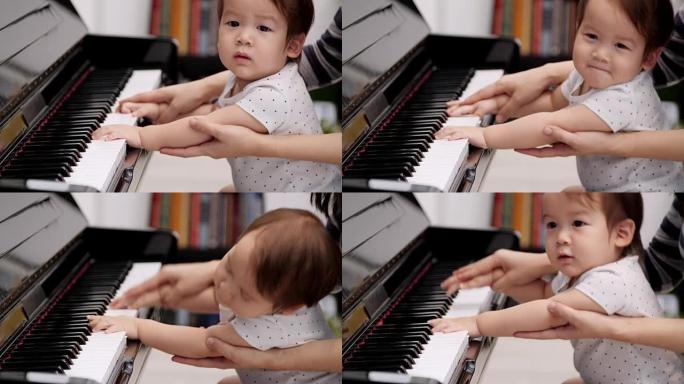 小孩和母亲一起弹钢琴的手的特写镜头