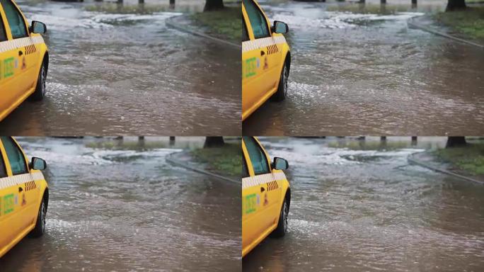 雨水倾泻在人行道上，出租车变成洪水