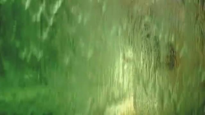 4K footage of water curtain close up through the g
