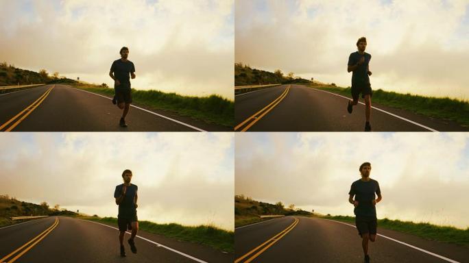 运动男子在日落时奔跑