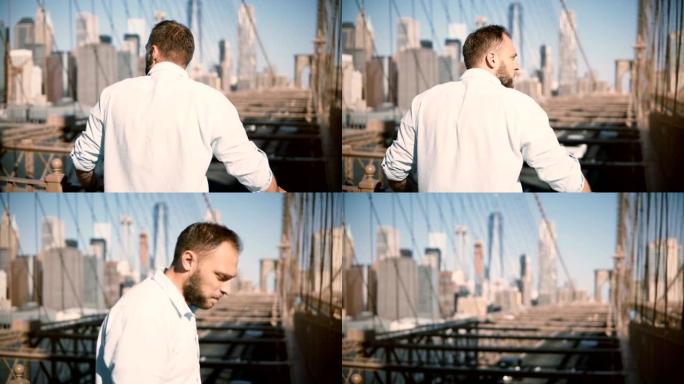 成年白人男子站在布鲁克林大桥栏杆旁，欣赏令人惊叹的城市风景，并离开4K