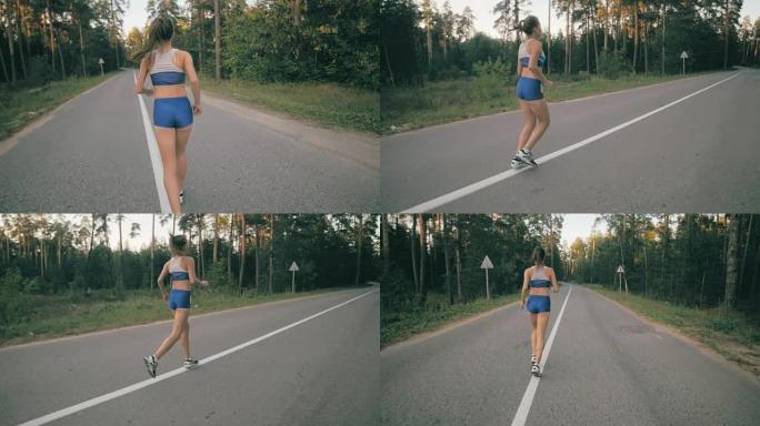 运动健壮的女人在公园慢跑。慢动作。Steadycam镜头