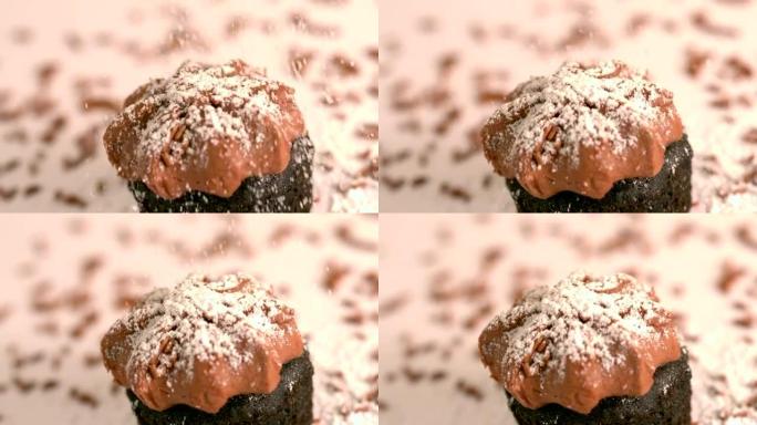 糖粉在巧克力磨砂纸杯蛋糕上过筛