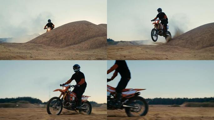 职业摩托车越野赛车手驾驶他的FMX摩托车在沙地越野赛道上越过沙丘。