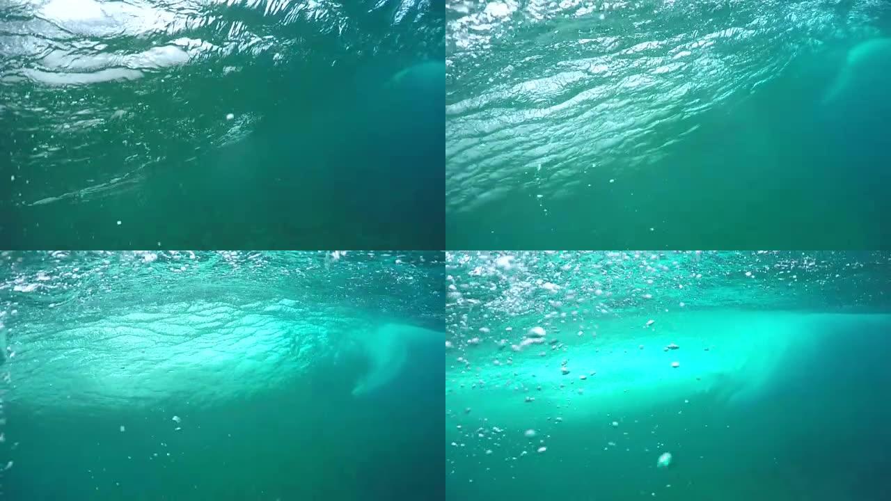 水下慢动作: 极限职业冲浪者骑大桶波