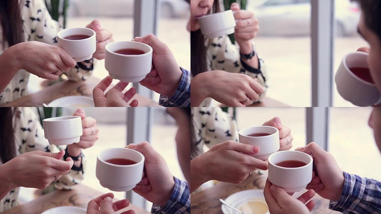 快乐的情侣在咖啡馆喝茶。第一次约会