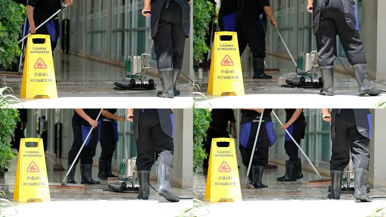 清洁服务团队用洗涤器清洁地板和清洁过程标签