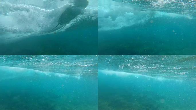 水下慢动作: 白色冲浪板在海洋中雕刻并产生涟漪