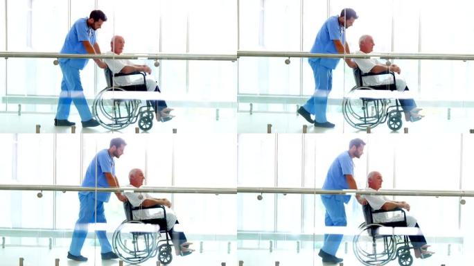 医生在通道上轮椅上抱着高级病人