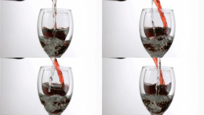 超级慢动作眼镜中的葡萄酒和水填充