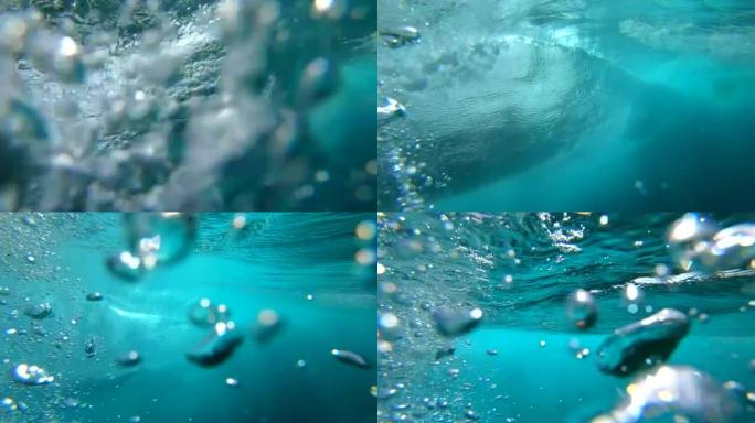 水下慢动作: 清晰的桶形波在海洋中击破相机