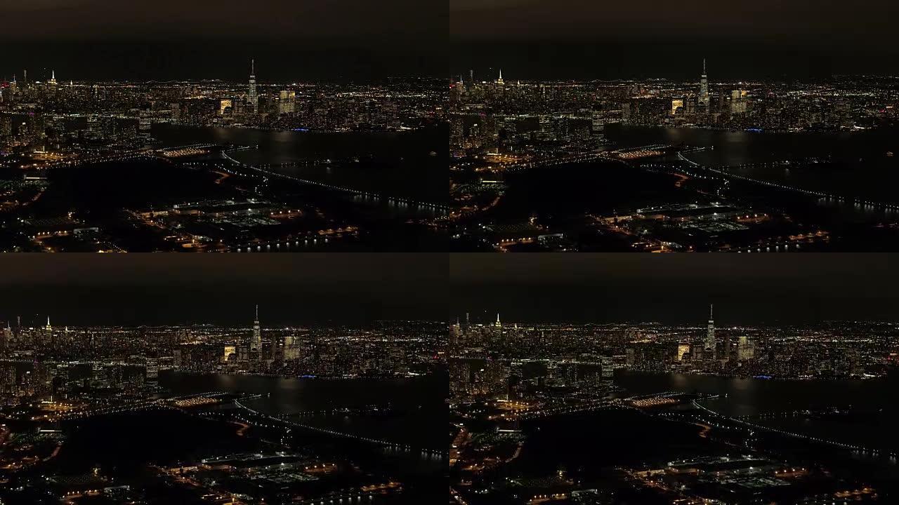 空中: 夜间令人惊叹的新泽西州和曼哈顿市中心的天际线