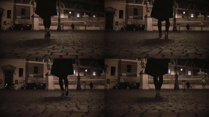 晚上女性脚走过荒芜的街道的特写镜头。孤独的女人回家晚了