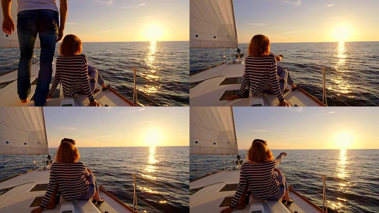SLO MO夫妇在船上欣赏日落的景色