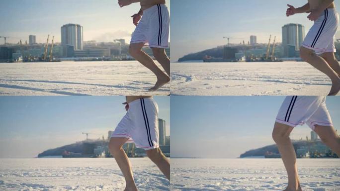 男人赤脚在冰冻的河上奔跑。