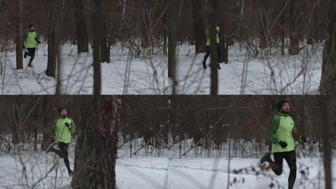 在冬季森林中奔跑的年轻运动员
