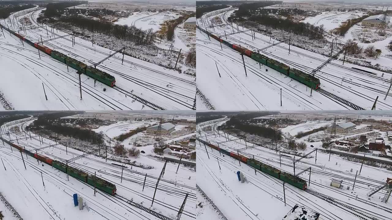 冬季铁路上的货运列车。汽油，油箱。空中射击