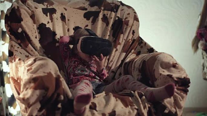 戴着VR眼镜的孩子透过它看