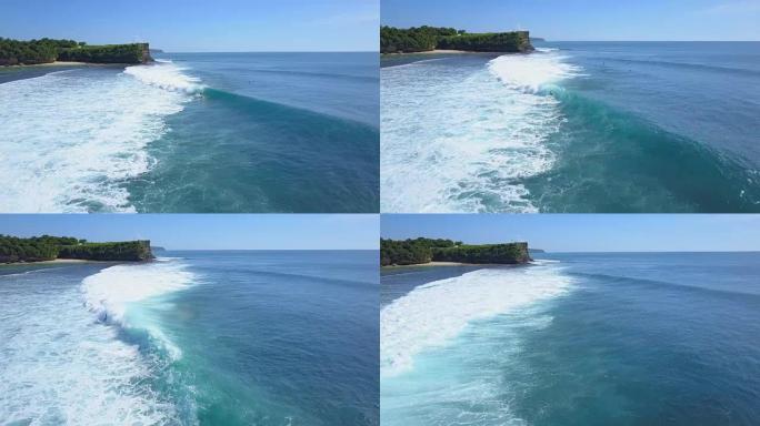空中: 暑假无法识别的冲浪者在巴厘岛骑着大桶浪