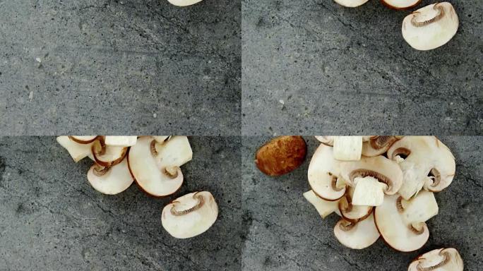 混凝土上切碎的蘑菇