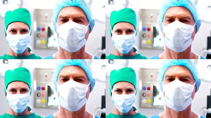 手术室中戴着外科口罩的外科医生的肖像