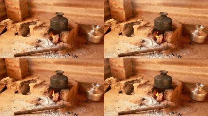 村里用粘土做成的炉子烧水
