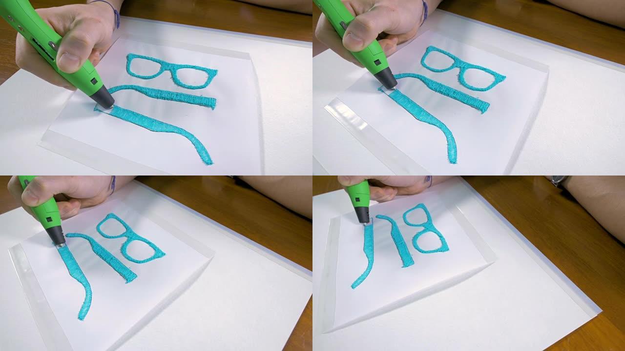 4K.男性手，带3D笔打印眼镜。现代技术工艺。