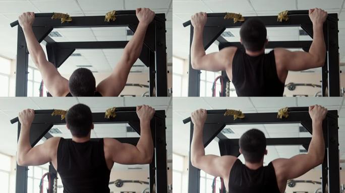 男性健美运动员在健身房拉起的特写镜头