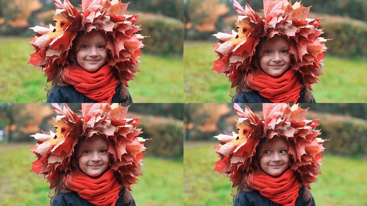 快乐微笑美丽可爱的小女孩的特写肖像秋天枫叶皇冠慢动作