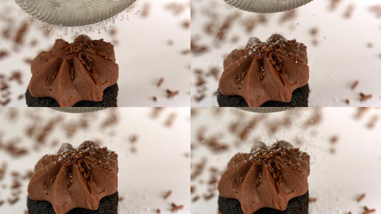 糖粉在巧克力蛋糕上过筛
